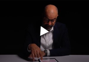 Still image of a videotaped reading by Brian Jones