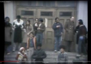 Still image from a video news report showing students walking around the front entrance of Mark Twain Junior High School