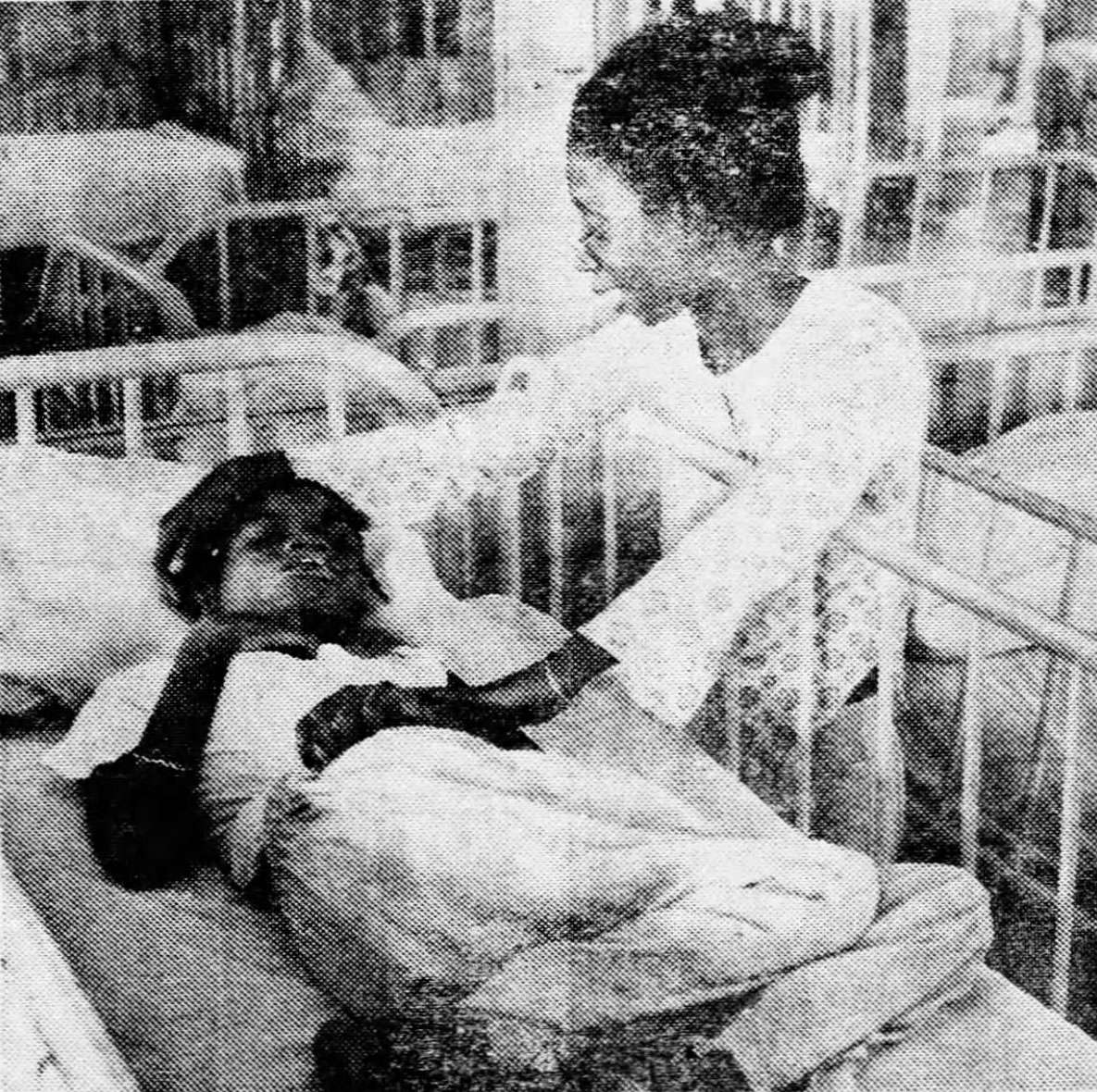 Newspaper clipping that includes a photo of Willie Mae Goodman, who is a Black woman, visiting her 18-year old daughter Marguerite in the Gouverneur State School.