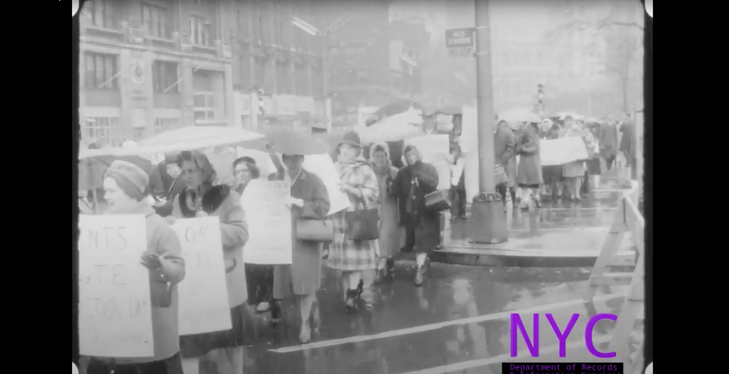 White women carry signs protesting desegregation