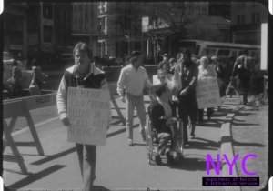 Children with disabilities, some in wheelchairs, march with their parents near City Hall in Manhattan