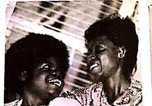 Marguerite Goodman and Willie Mae Goodman sit next to each other. Both are smiling.